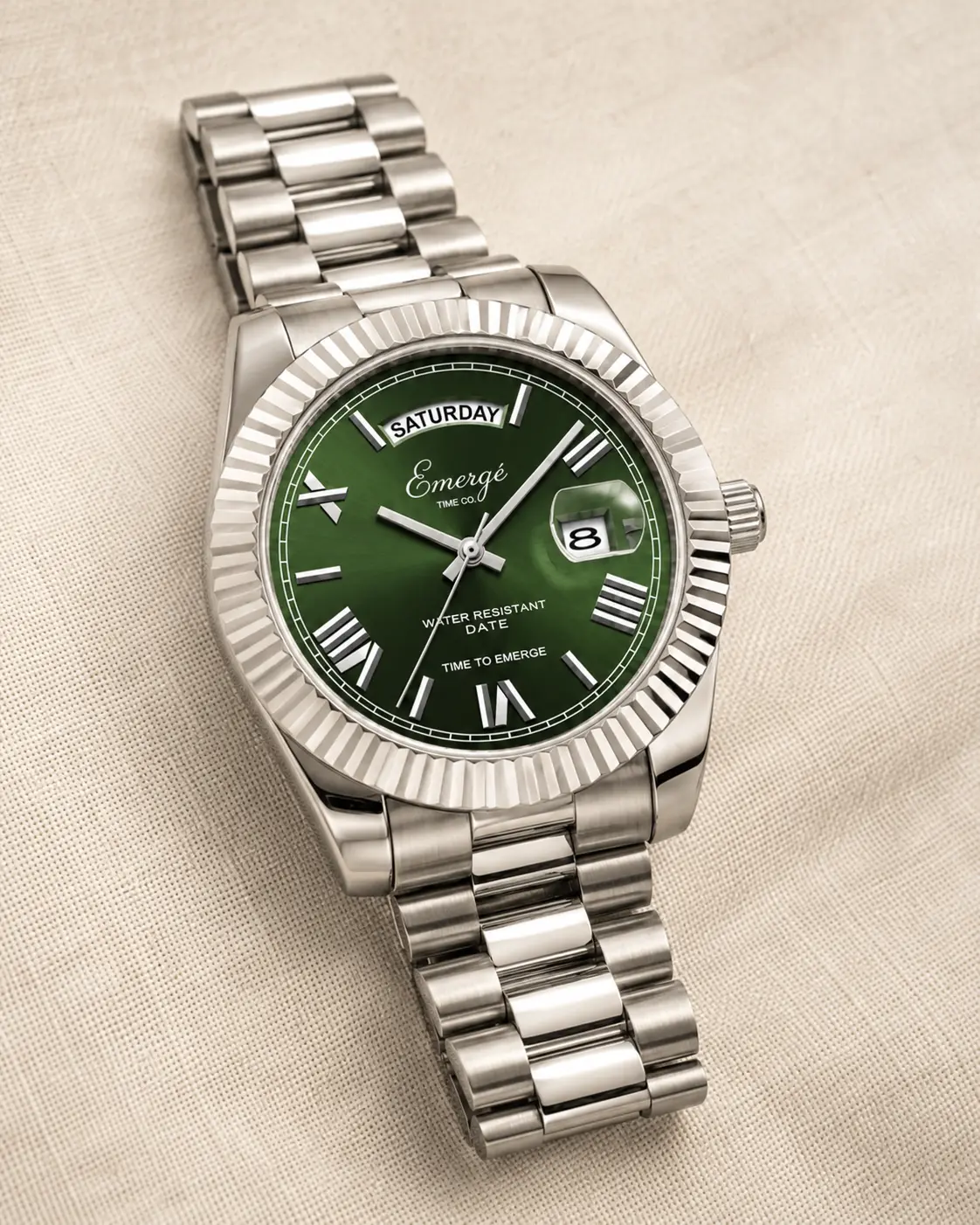 Emergé Scarlett with a green sunray dial, fluted bezel, and stainless-steel bracelet
